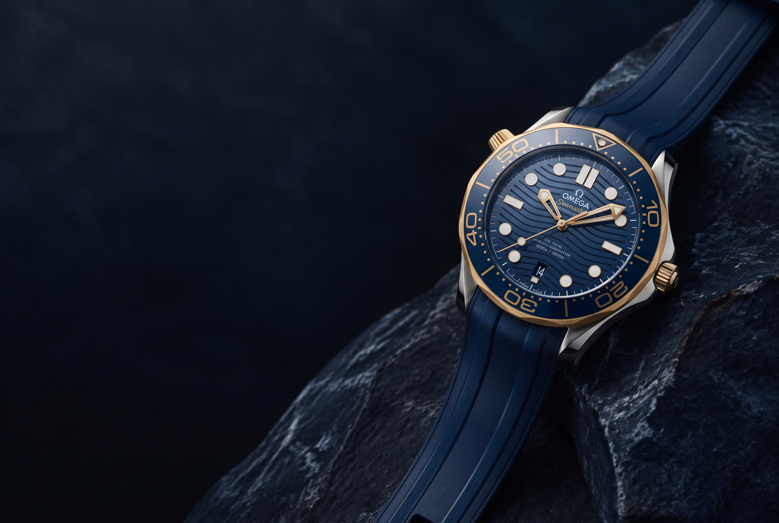 Blue-dial Omega watch with a gold bezel and blue strap on dark stone